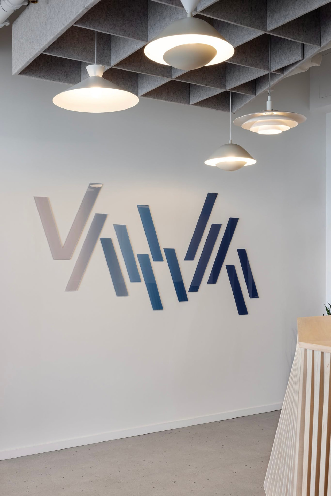 Reception mark — the chart line rebuilt in acrylic slats, stepping from bone to deep navy.