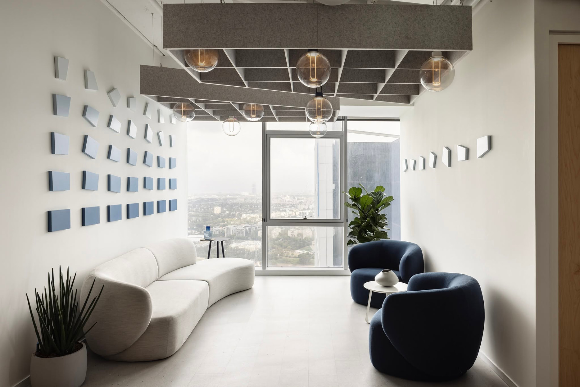 Lounge — wall, ceiling raft and furniture palette resolving into one room.